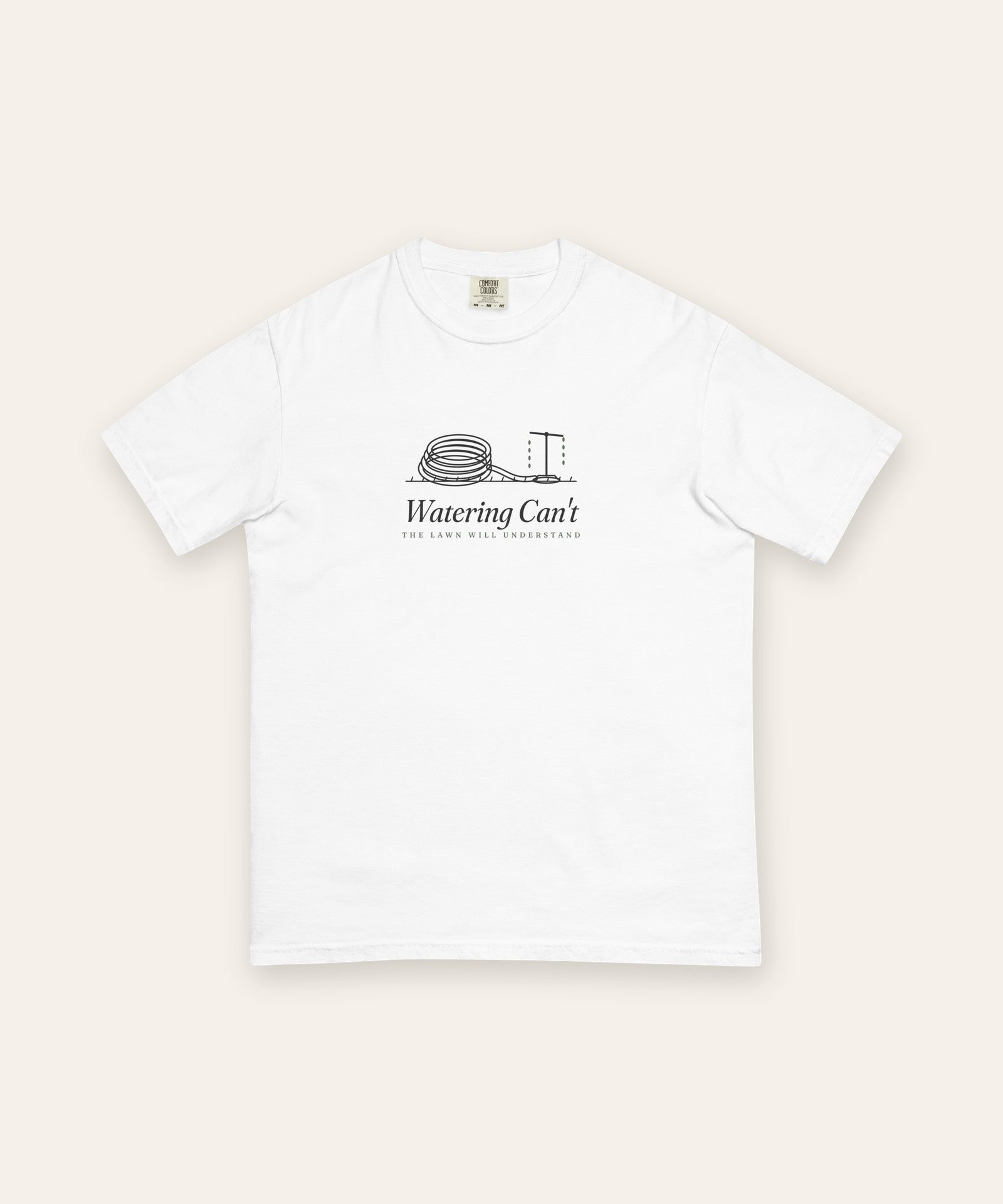 The Watering Can't Tee in White, flat lay front, product shot on cream