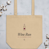 The Wine Run Tote flat on stone with cotton stems