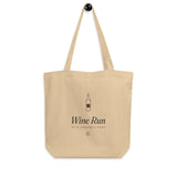 The Wine Run Tote hanging on a hook