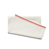The Small Talk Kitchen Towel, folded, showing the tomato stripes