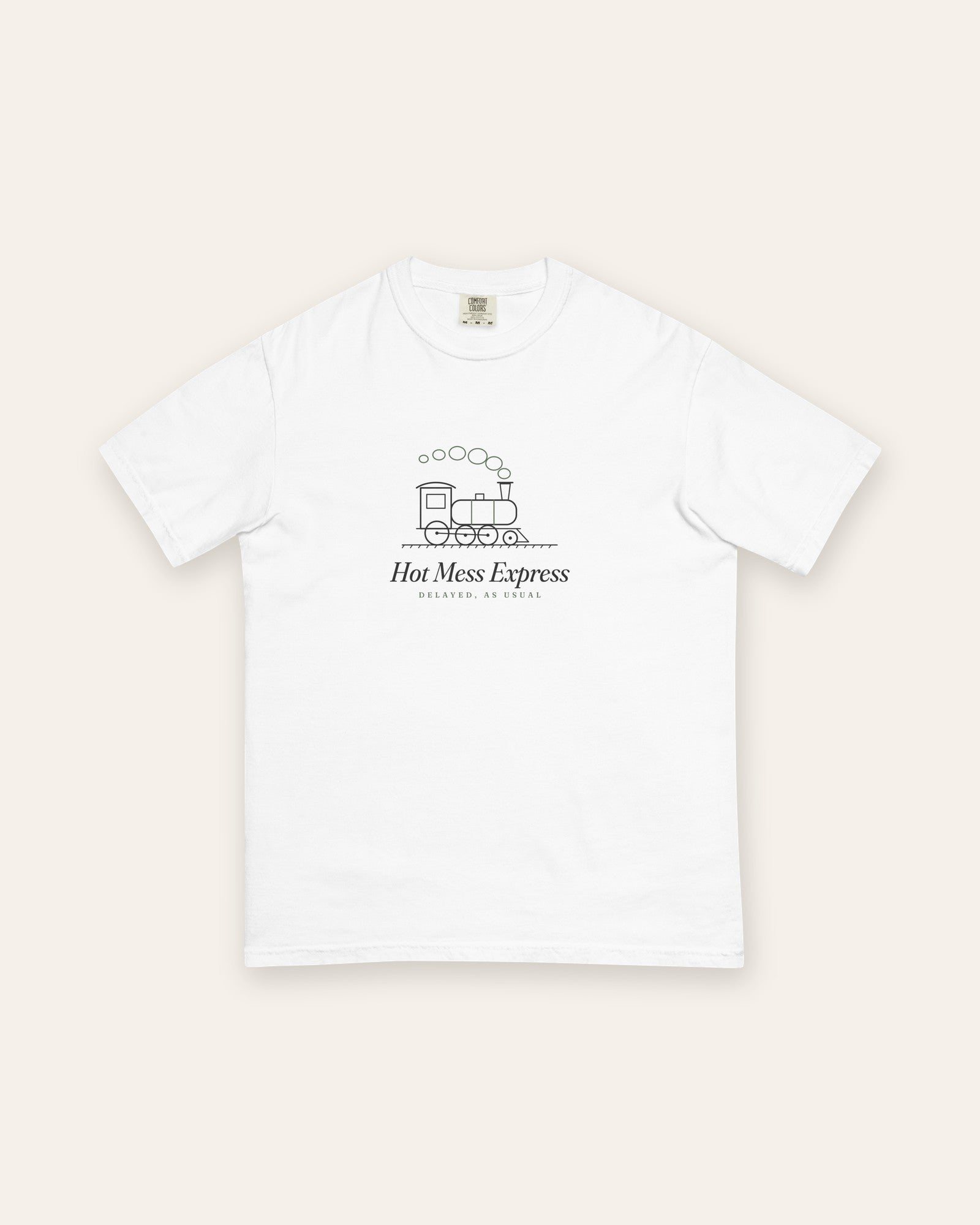 The Hot Mess Express Tee in White, flat lay front, product shot on cream