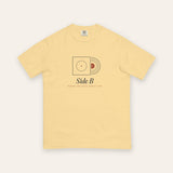 The Side B Tee in Butter, flat lay front, product shot on cream