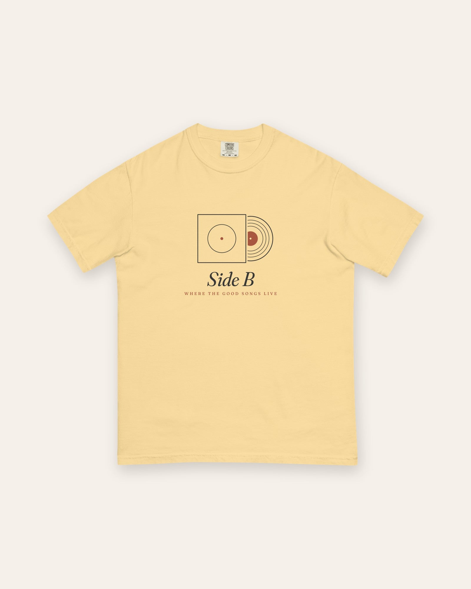 The Side B Tee in Butter, flat lay front, product shot on cream