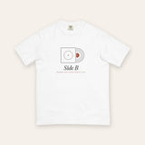 The Side B Tee in White, flat lay front, product shot on cream