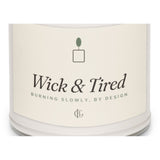 The Wick and Tired Candle in Clean Cotton, close-up of the design