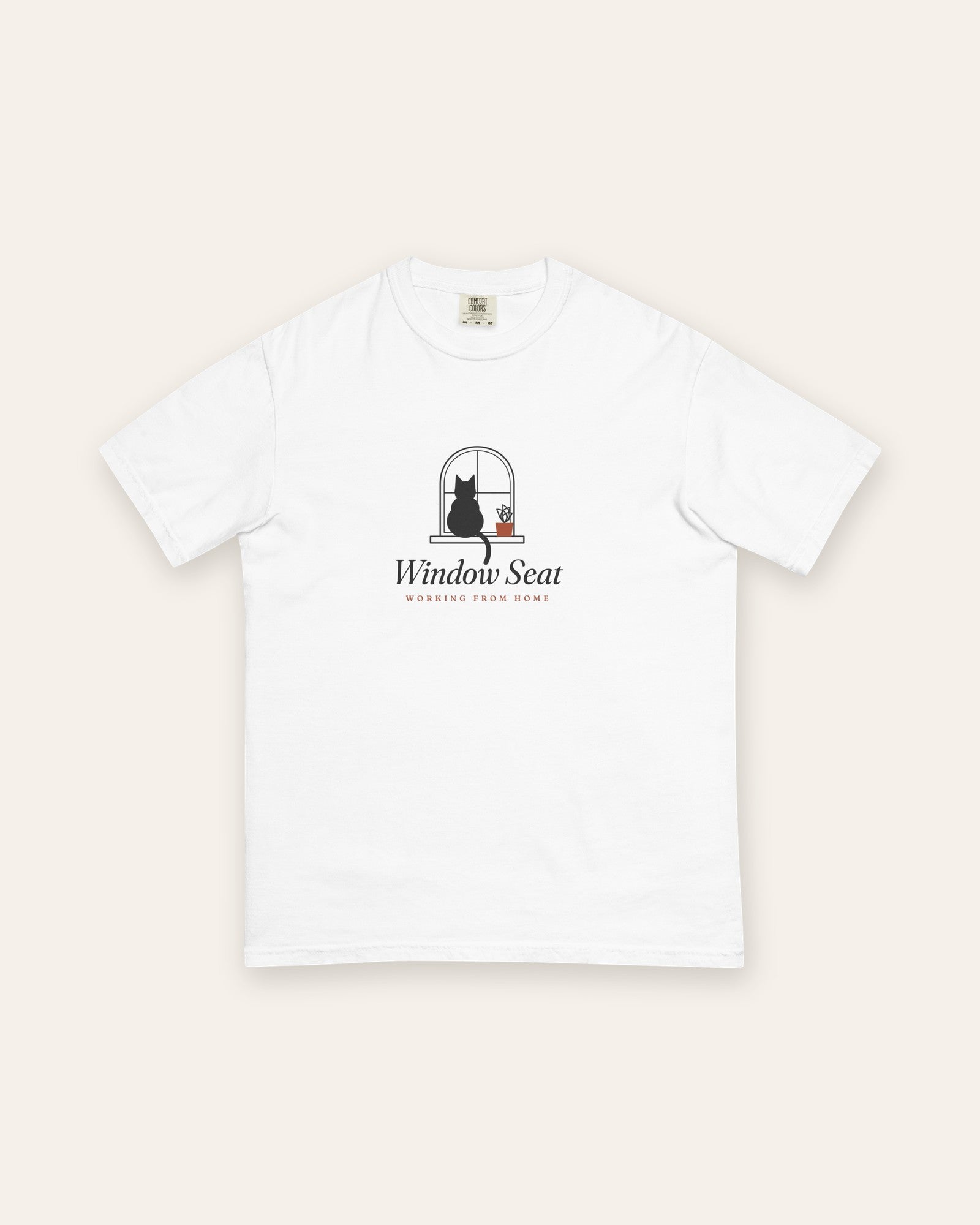 The Window Seat Tee in White, flat lay front, product shot on cream