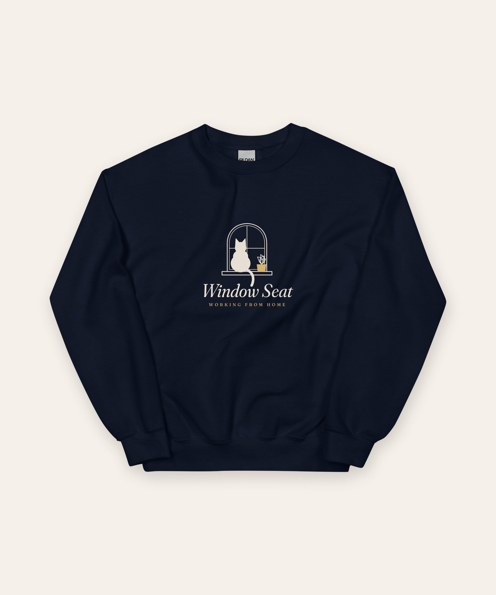 The Window Seat Crewneck in Navy, flat lay front, product shot on cream