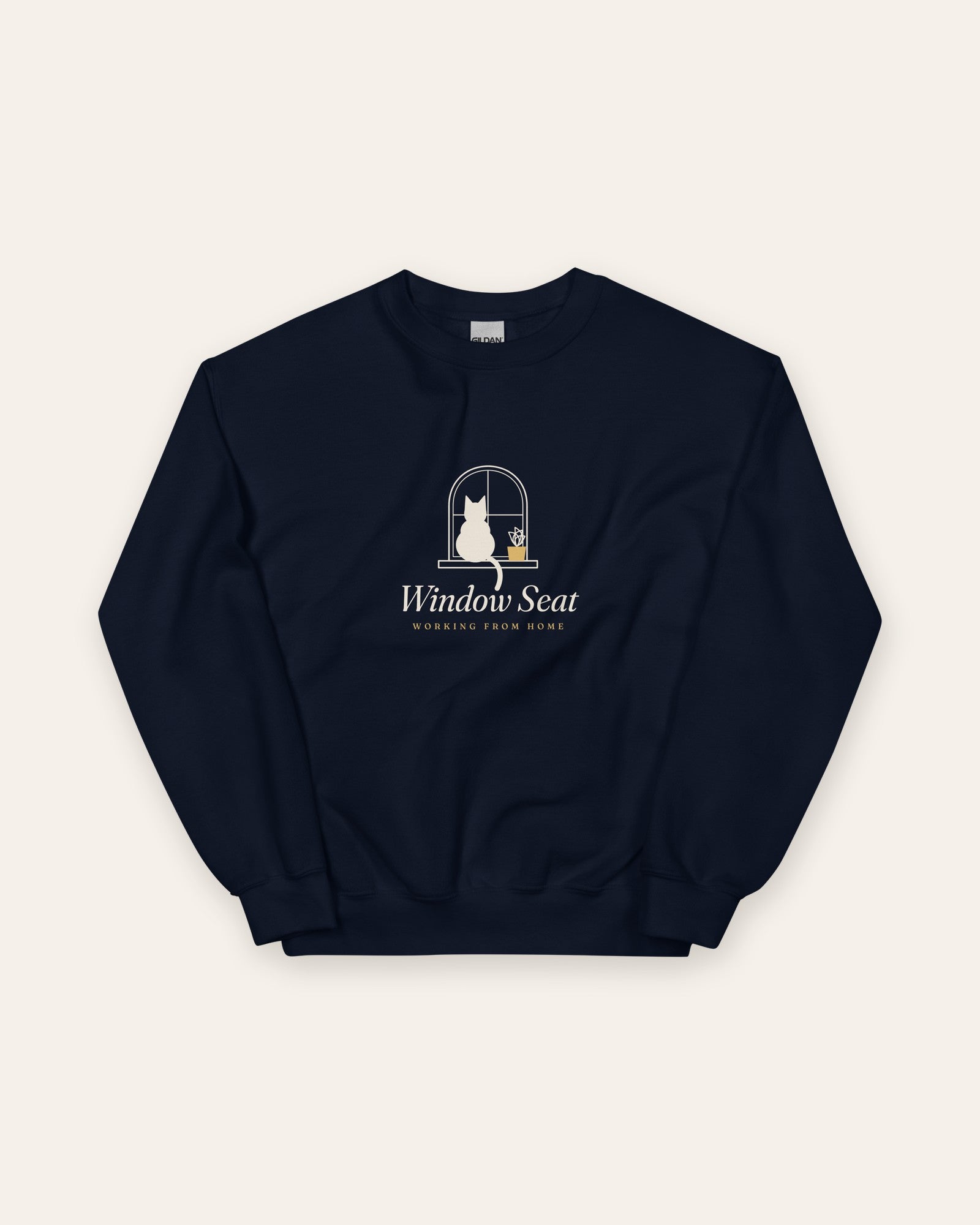 The Window Seat Crewneck in Navy, flat lay front, product shot on cream