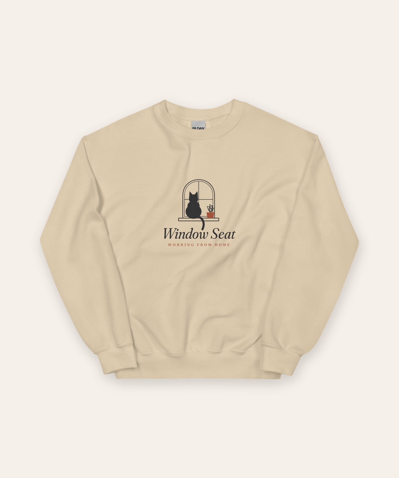 The Window Seat Crewneck in Sand, flat lay front, product shot on cream
