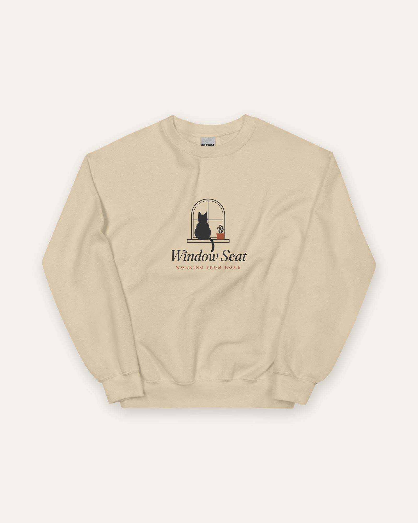 The Window Seat Crewneck in Sand, flat lay front, product shot on cream