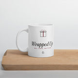 The Wrapped Up Mug in White, styled on a table