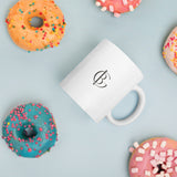 The Wrapped Up Mug in White, styled on a table