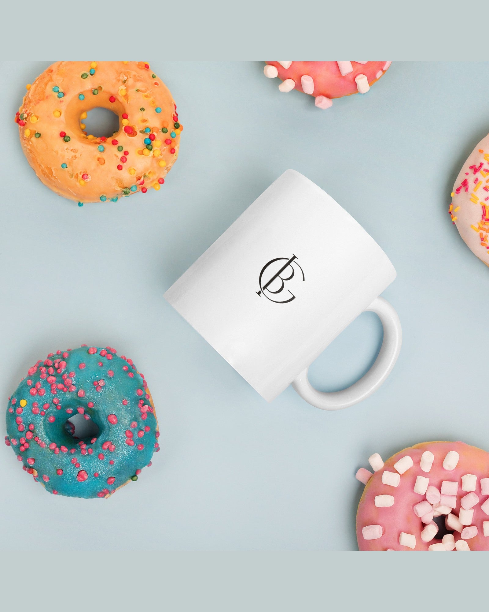 The Wrapped Up Mug in White, styled on a table