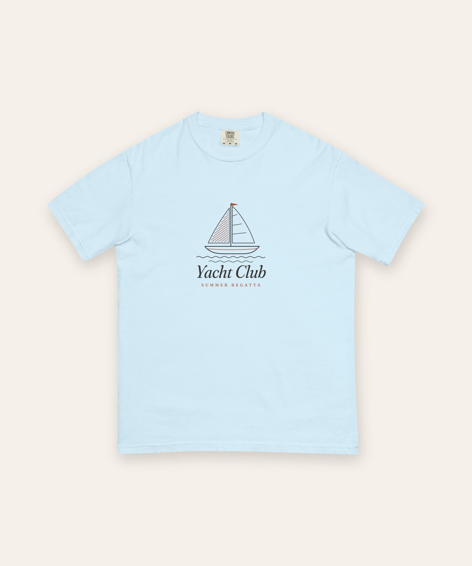 The Yacht Club Tee in Chambray, flat lay front, product shot on cream