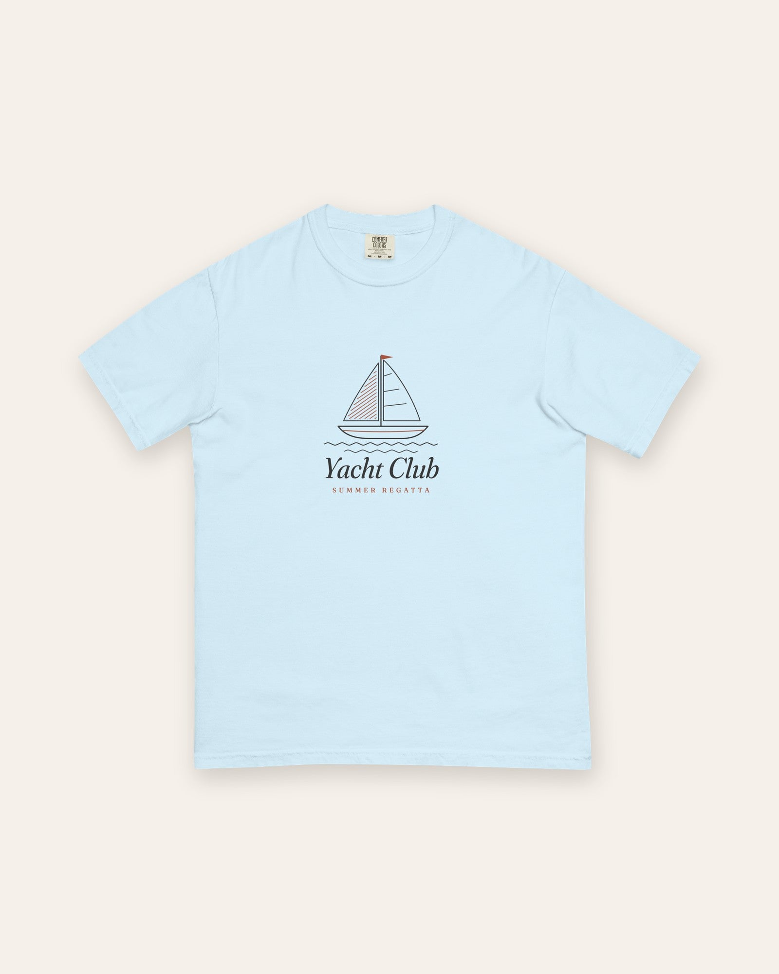 The Yacht Club Tee in Chambray, flat lay front, product shot on cream