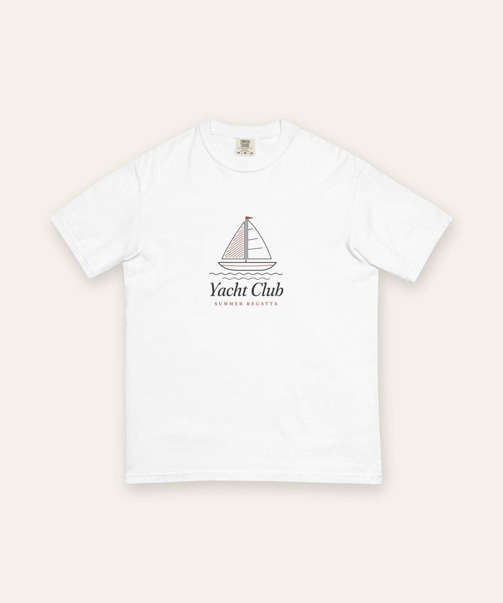 The Yacht Club Tee in White, flat lay front, product shot on cream