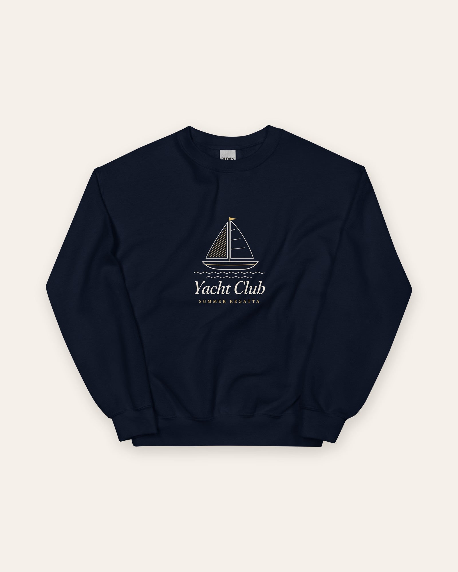 The Yacht Club Crewneck in Navy, flat lay front, product shot on cream